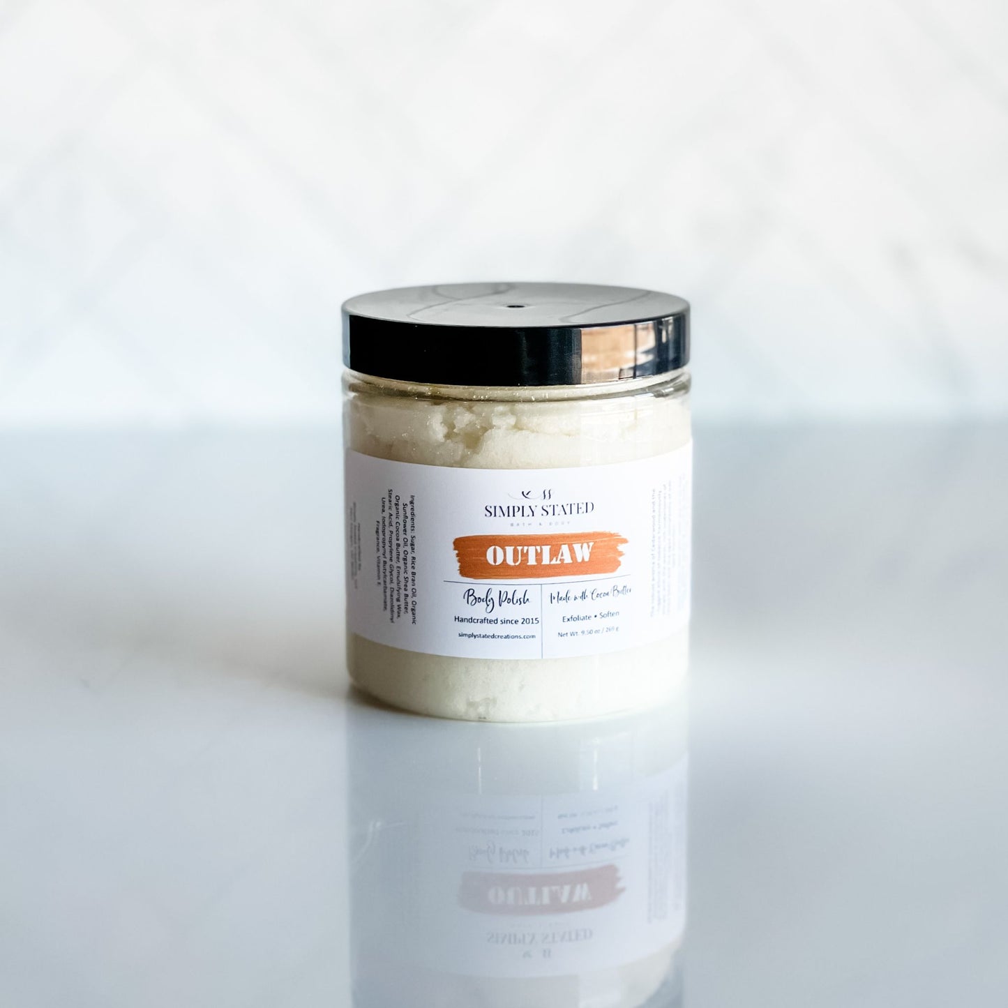 Limited edition Outlaw Body Polish by Simply Stated with rugged, gender-neutral scent and exfoliating texture.