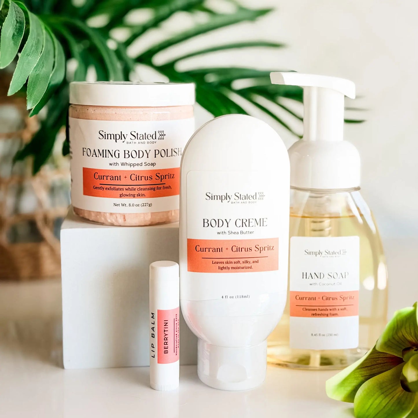 Simply Stated Self Care Starter Kit in Currant and Citrus Spritz — foaming body polish, body creme, foaming hand soap, and Berrytini lip balm, 2026 anniversary scent
