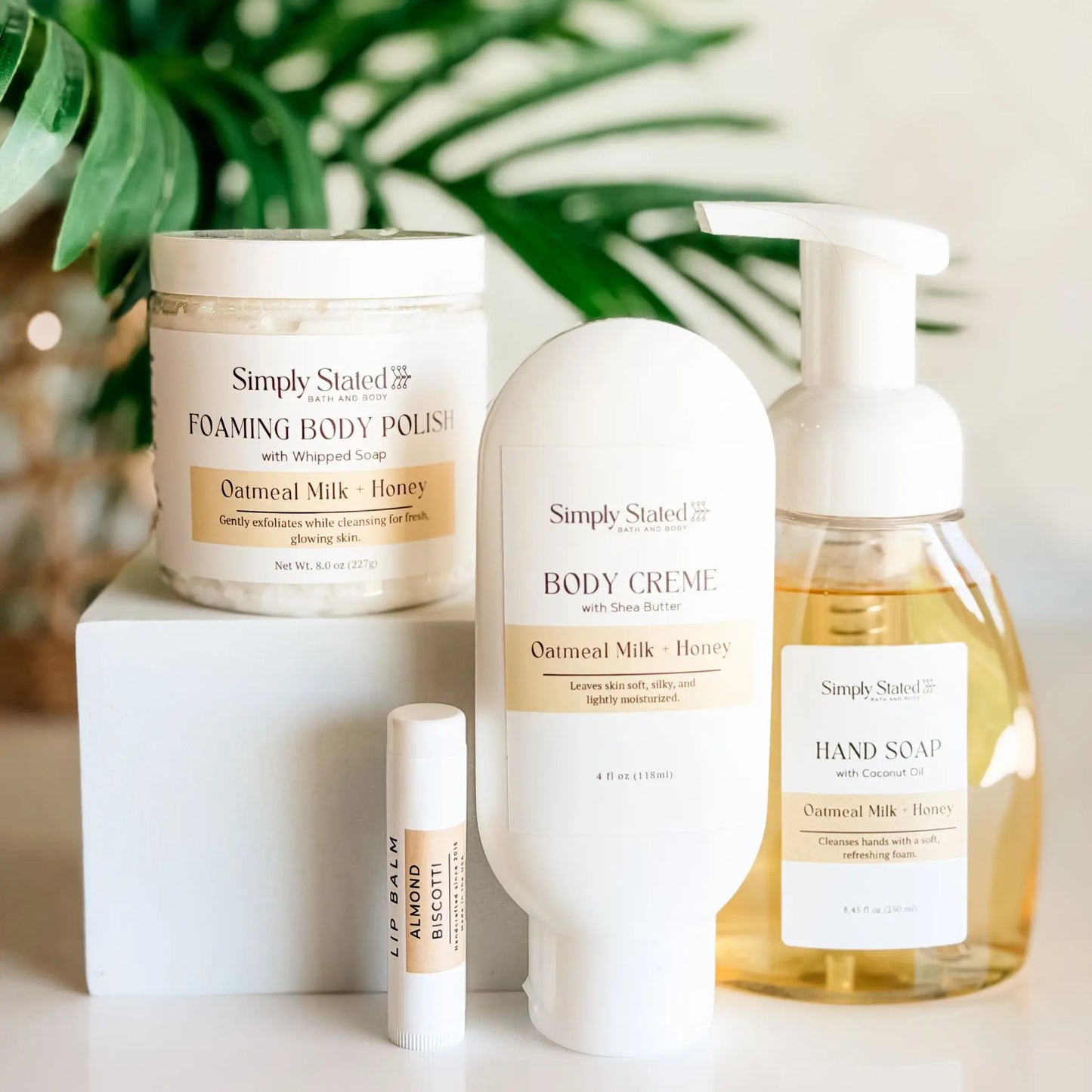 Simply Stated Self Care Starter Kit in Oatmeal Milk and Honey — foaming body polish, body creme, foaming hand soap, and Almond Biscotti lip balm, handcrafted in Colorado