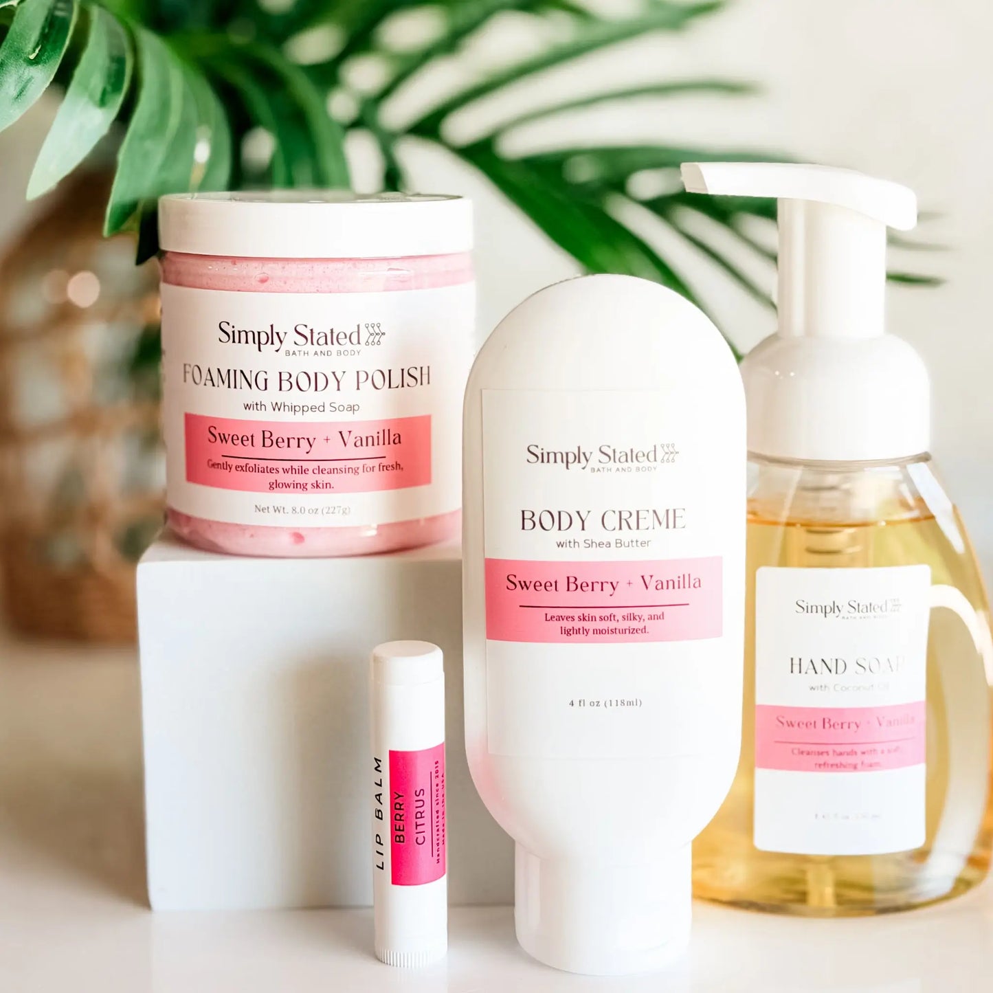 Simply Stated Self Care Starter Kit in Sweet Berry and Vanilla — foaming body polish, body creme, foaming hand soap, and Berry Citrus lip balm, handcrafted in Colorado