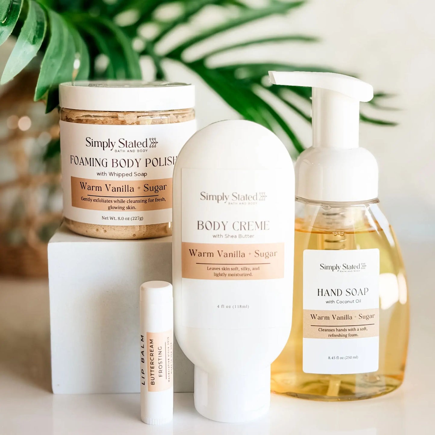 Simply Stated Self Care Starter Kit in Warm Vanilla and Sugar — foaming body polish, body creme, foaming hand soap, and Buttercream Frosting lip balm, handcrafted in Fort Morgan Colorado