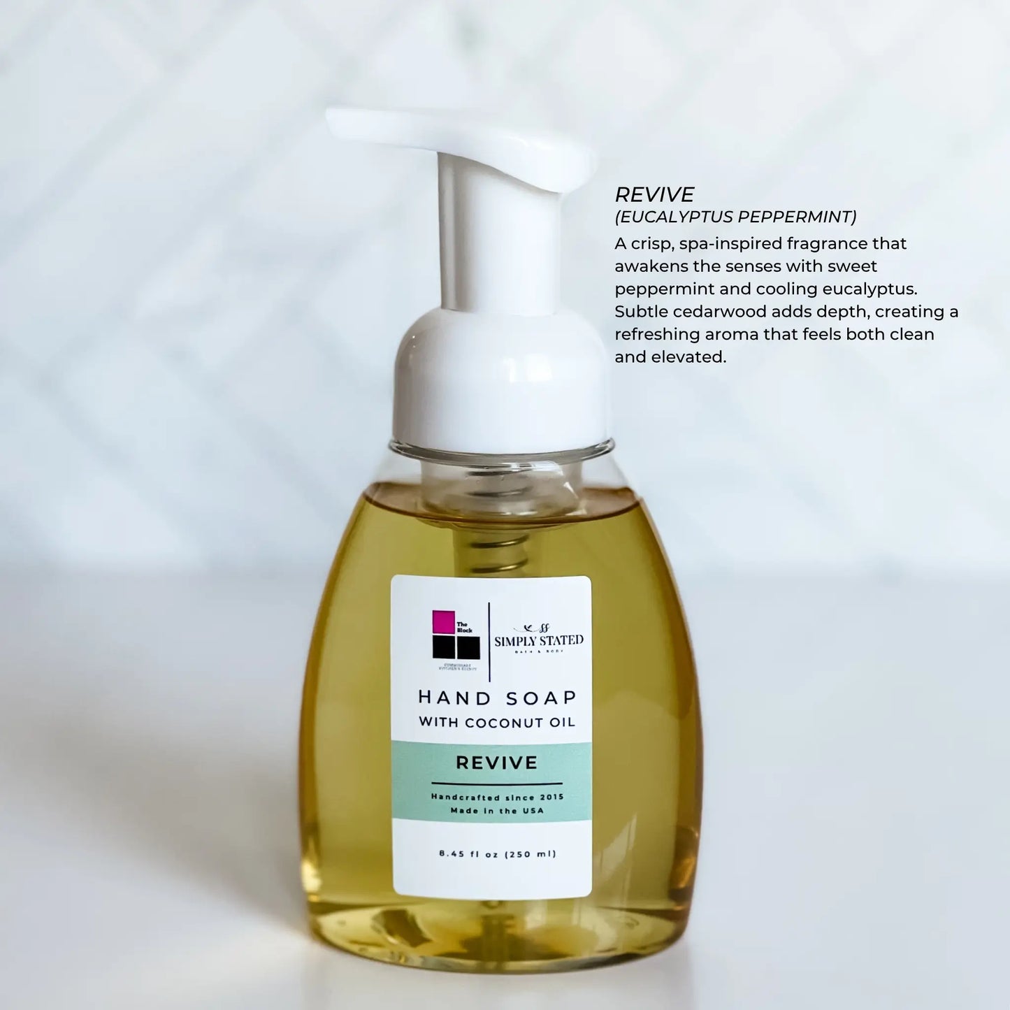 The Block x Simply Stated Foaming Hand Soap with pump in fragrance Revive with clean minimalist background.