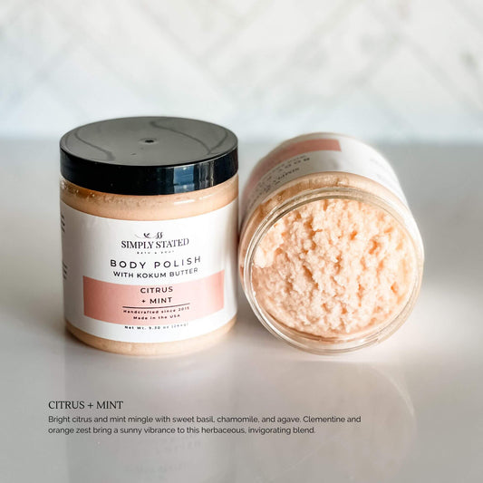 Invigorating Citrus + Mint Body Polish by Simply Stated with orange-toned scrub for fresh, herbal exfoliation