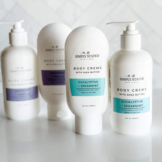 Simply Stated Bath & Body Aromatherapy Body Creme lineup featuring 4oz squeeze and 8oz pump bottles in Eucalyptus + Spearmint. New sizes and updated packaging for a fresh, invigorating self-care experience.
