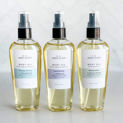 Simply Stated Bath & Body Aromatherapy Body Oils featuring Eucalyptus + Spearmint, Lavender + Vanilla, and Rosemary + Eucalyptus. Hydrating oils blended with essential oils for relaxation, relief, and rejuvenation in 4oz bottles.