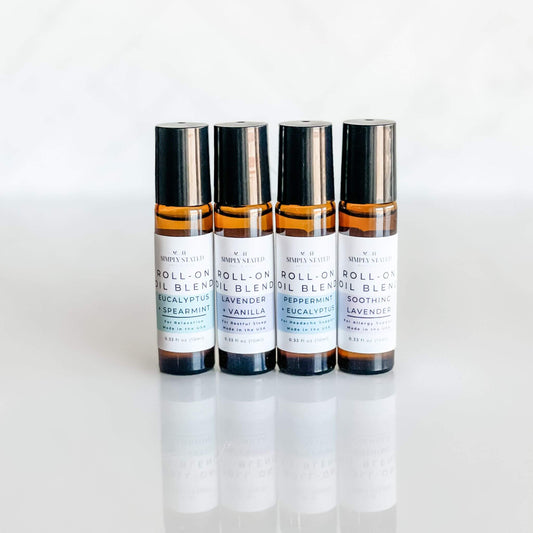 Simply Stated Bath & Body Aromatherapy Rollers featuring Eucalyptus + Spearmint, Lavender + Vanilla, Peppermint + Eucalyptus, and Soothing Lavender. Each blend offers a unique self-care experience in a convenient roll-on design.