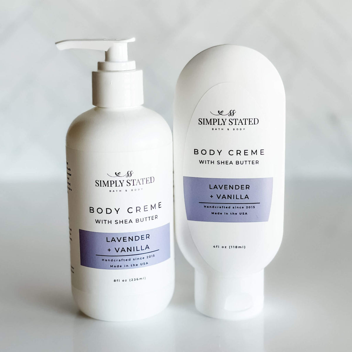 Simply Stated Bath & Body Lavender Vanilla Body Creme with Shea Butter, pump and tube bottles side by side.