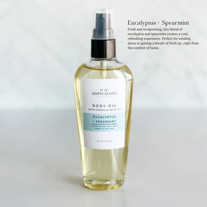Body oil bottle with a label on a white background. Eucalyptus Spearmint is fresh and invigorating, this blend of eucalyptus and spearmint creates a cool, refreshing experience. Perfect for winding down or getting a breath of fresh air, right from the comfort of home.