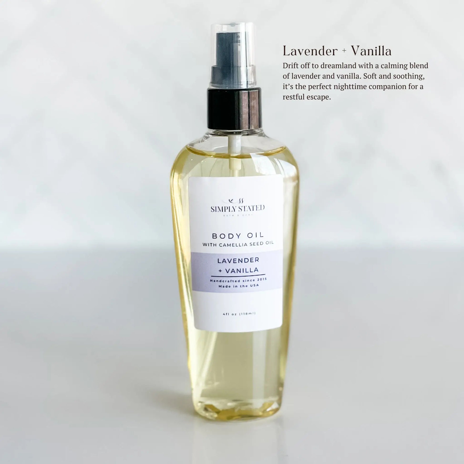 Body oil bottle labeled 'Lavender Vanilla' on a white background. Drift off to dreamland with a calming blend of lavender and vanilla. Soft and soothing, it’s the perfect nighttime companion for a restful escape.