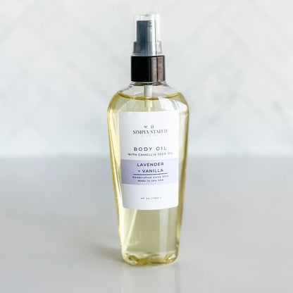 Body oil bottle labeled 'Lavender & Vanilla' on a white background