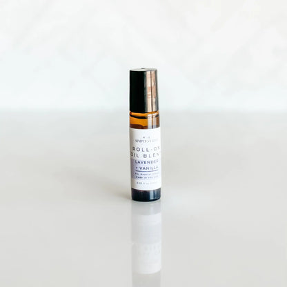 Roll-on oil blend bottle with lavender and vanilla on a white background