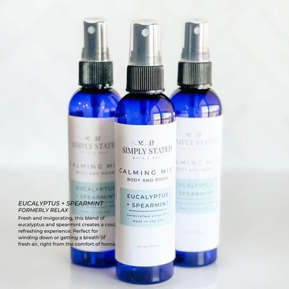 Simply Stated Bath & Body Calming Mist in Eucalyptus + Spearmint, a refreshing body and room spray. Infused with a cool blend of essential oils to promote relaxation and rejuvenation. Handmade in a 4oz blue bullet bottle.