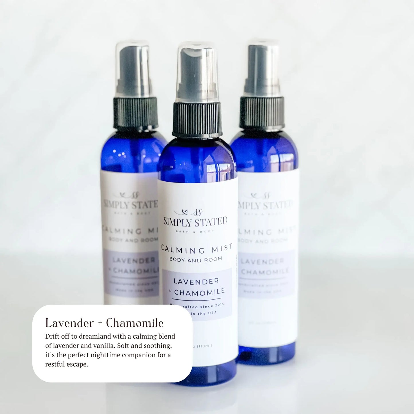 Three bottles of Simply Stated Lavender + Chamomile calming mist on a white background