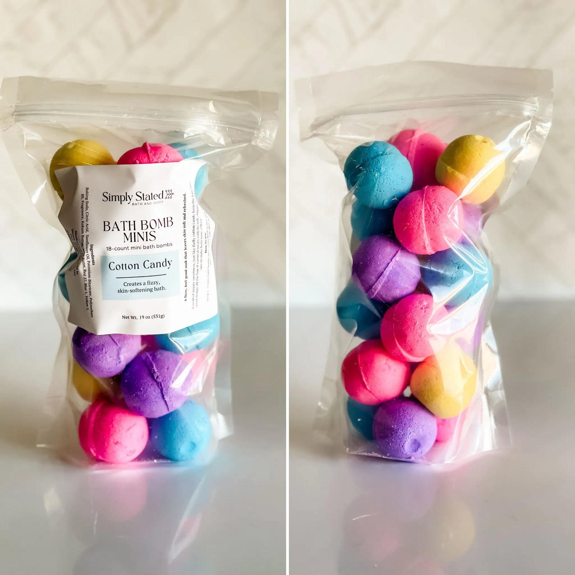 Packaged bath bomb minis with colorful spheres and 'Simply Stated' label on a white background