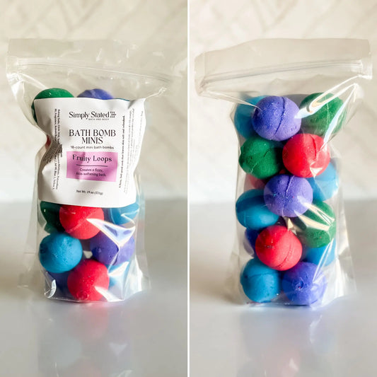 Packaged bath bomb minis with colorful balls and 'Simply Stated' label on a white background
