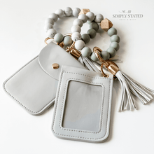 Card Case in Grey. Includes silicone beaded keychain (white marble and grey) and matching grey tassle