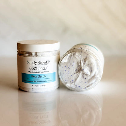 Simply Stated Cool Feet Pedi Scrub jar open showing white foaming scrub texture — mentholated foot polish with cocoa butter and shea butter, made in small batches in Colorado