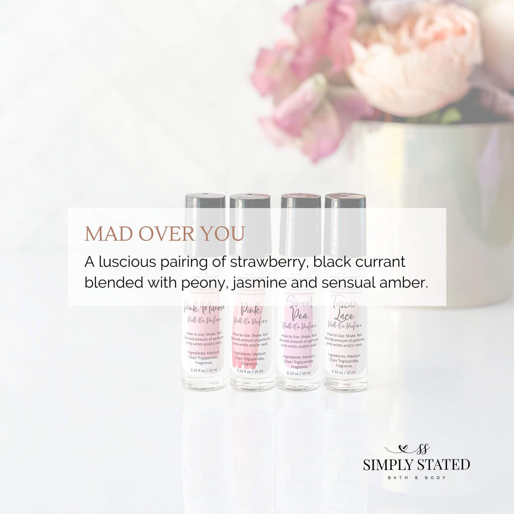 Mad Over You Roll-On Perfume. A luscious pairing of strawberry, black currant blended with peony, jasmine and sensual amber.