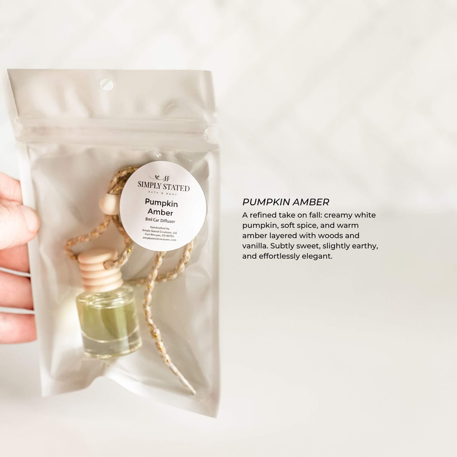 Pumpkin Amber diffuser with packaging on a white background
