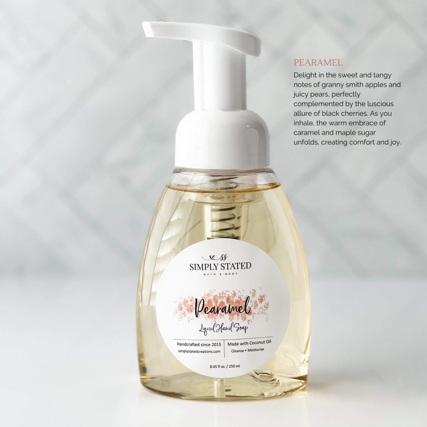 Winter Collection Hand Soap in Pearamel. Scent description "Delight in the sweet and tangy notes of granny smith apples and juicy pears, perfectly complemented by the luscious allure of black cherries. As you inhale, the warm embrace of caramel and maple sugar unfolds, creating comfort and joy."