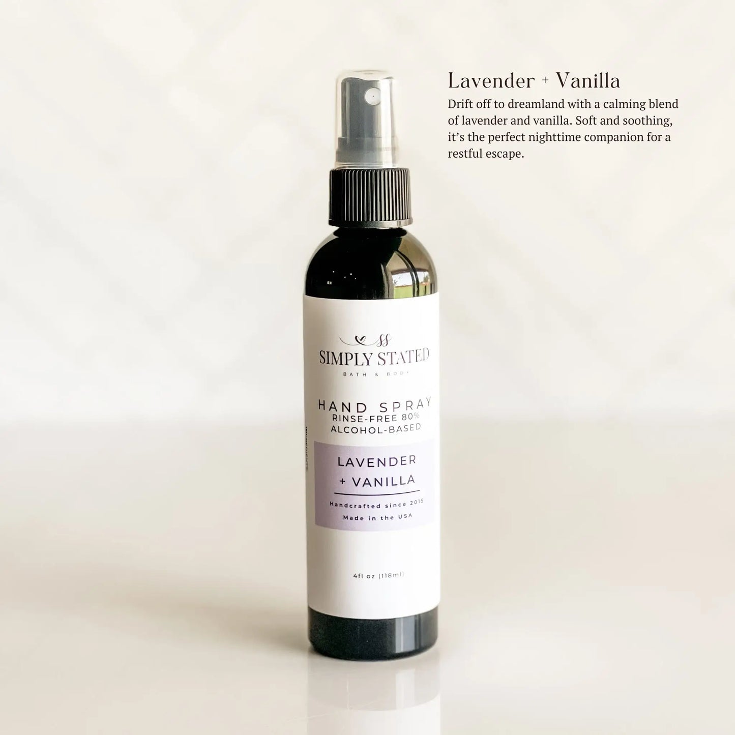 Hand spray bottle labeled 'Lavender + Vanilla' by Simply Stevies on a white background