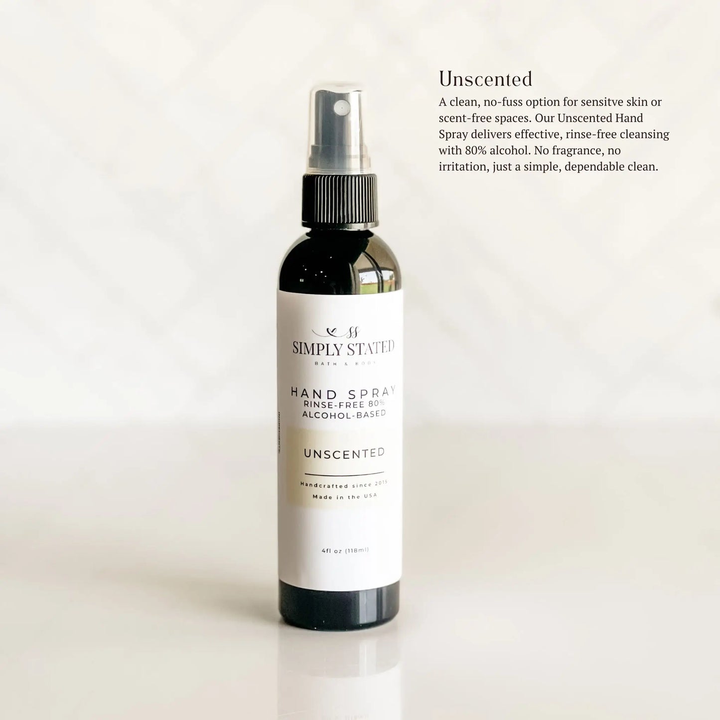 Unscented hand spray bottle with label on a light background