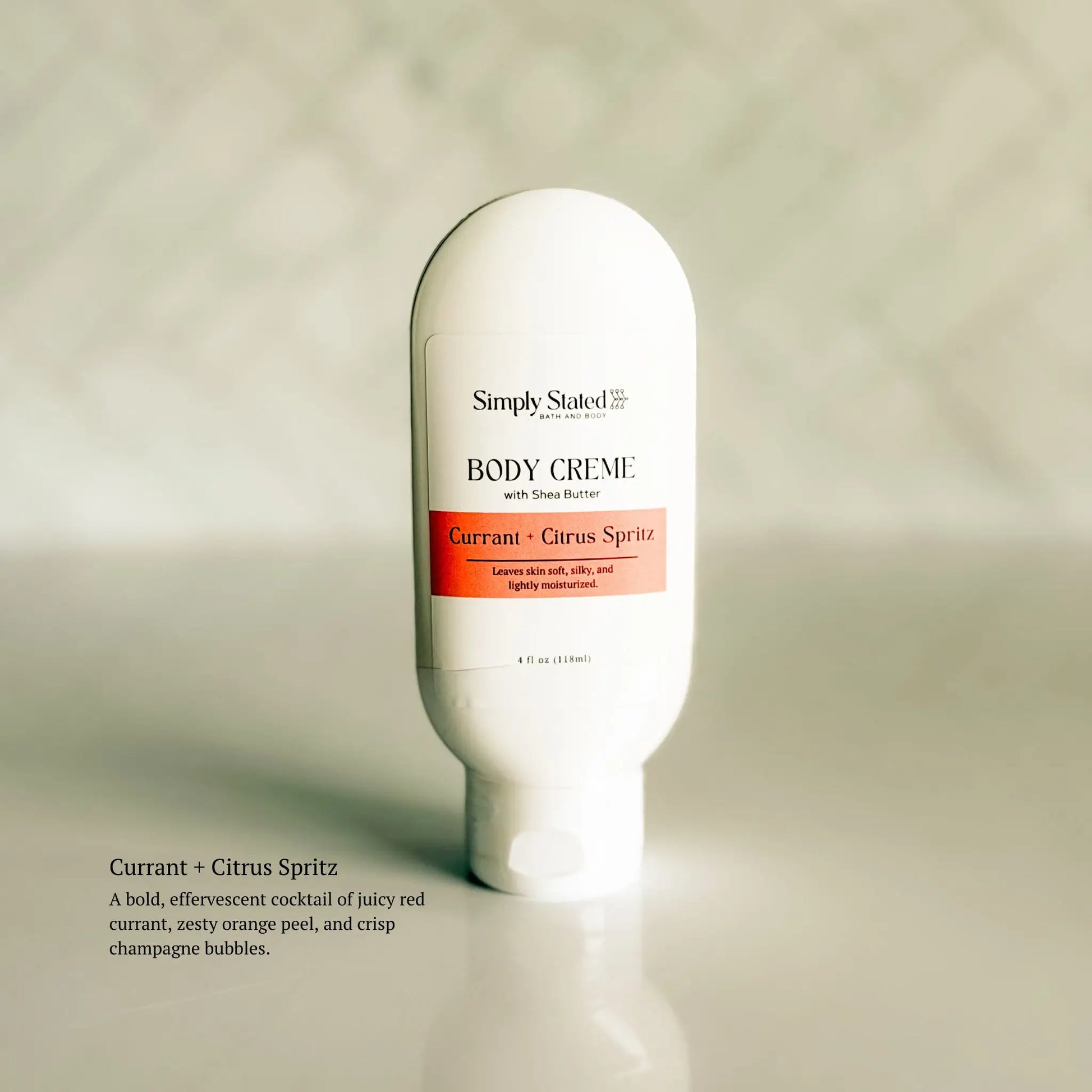 Body crème bottle labeled 'Simply Stated' on a neutral background