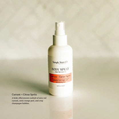 Body spray bottle labeled 'Simply Stated' on a beige background