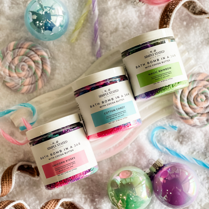 Bath bomb in a jar with cocoa butter in unicorn kisses, cotton candy and magic rainbow scents by Simply Stated