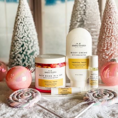 Tropical twist bath bomb in a jar, shea butter body creme, lip balm and roll-on perfume by Simply Stated Bath & Body