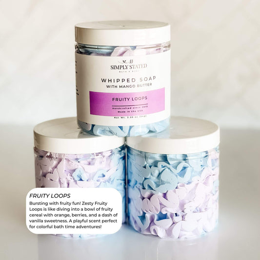 Simply Stated Bath & Body Fruity Loops Whipped Soap for kids. Bursting with vibrant colors and a playful fruity cereal scent, this whipped soap creates a fun and colorful bath time experience. Made with mango butter for soft, nourished skin.