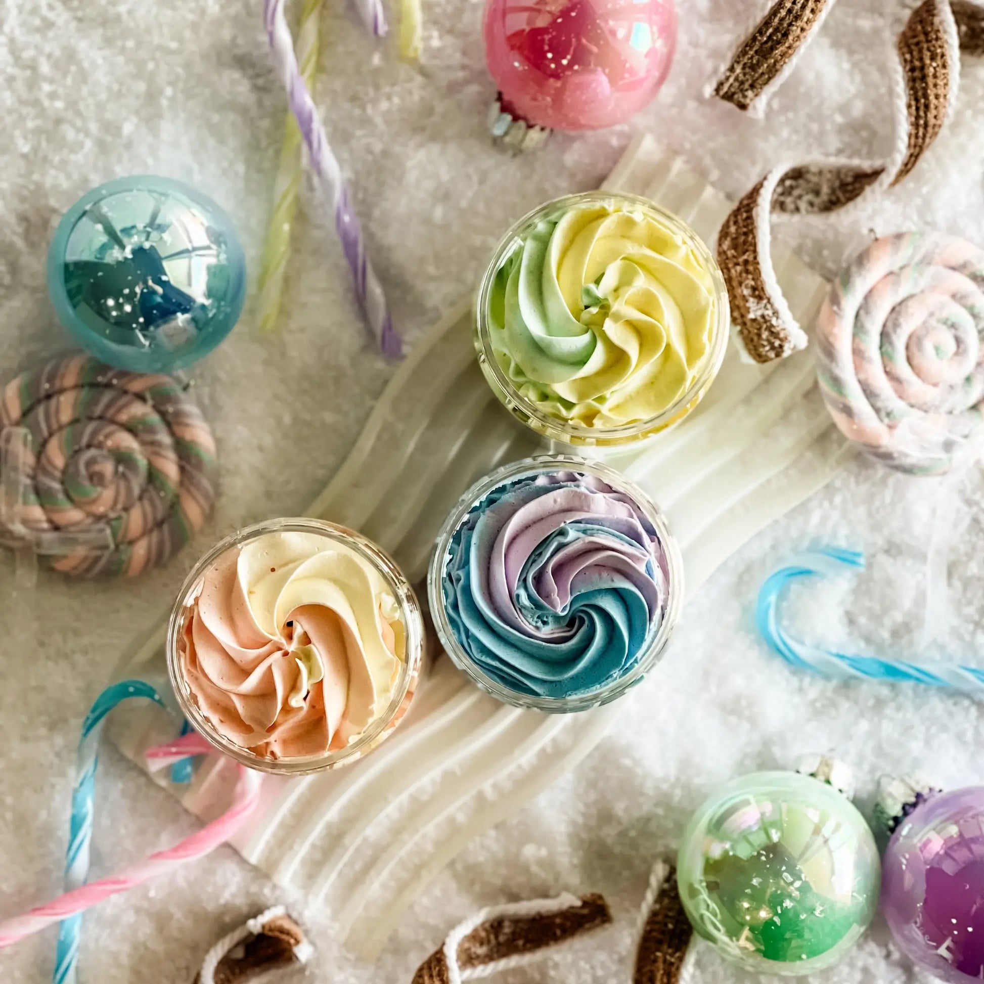 Colorful swirl candies and lollipops on a textured surface