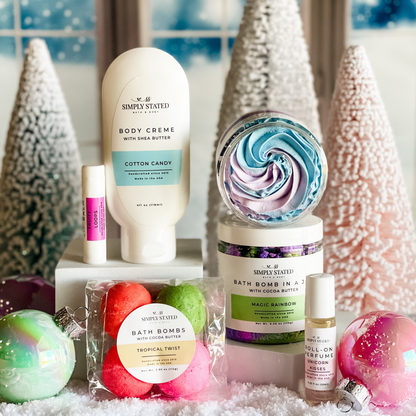 Simply Stated candy-scented body creme, lip balm, bath bombs and roll-on perfume with pastel trees and ornaments