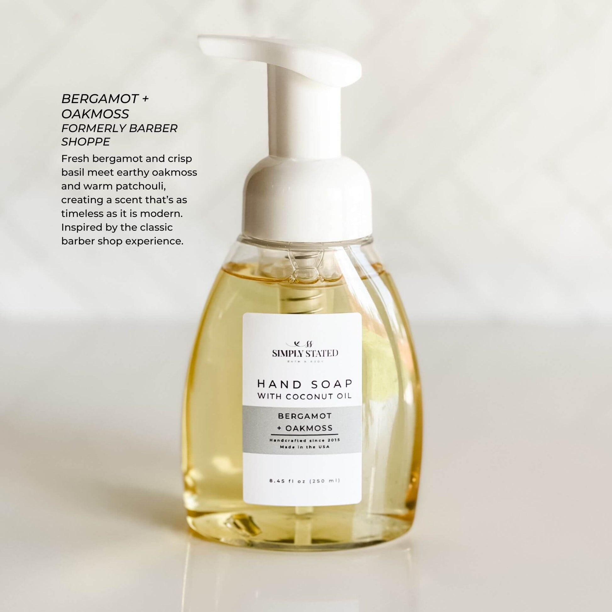 Bergamot + Oakmoss Men’s Foaming Hand Soap in white bottle with grey label