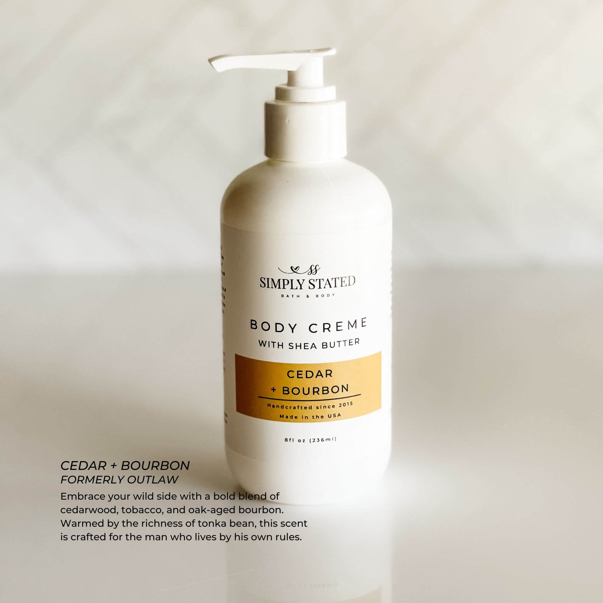 Cedar + Bourbon 8 oz body creme with pump top, part of Simply Stated’s men’s grooming line.