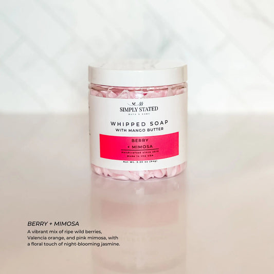 Jar of whipped soap with pink contents on a white background