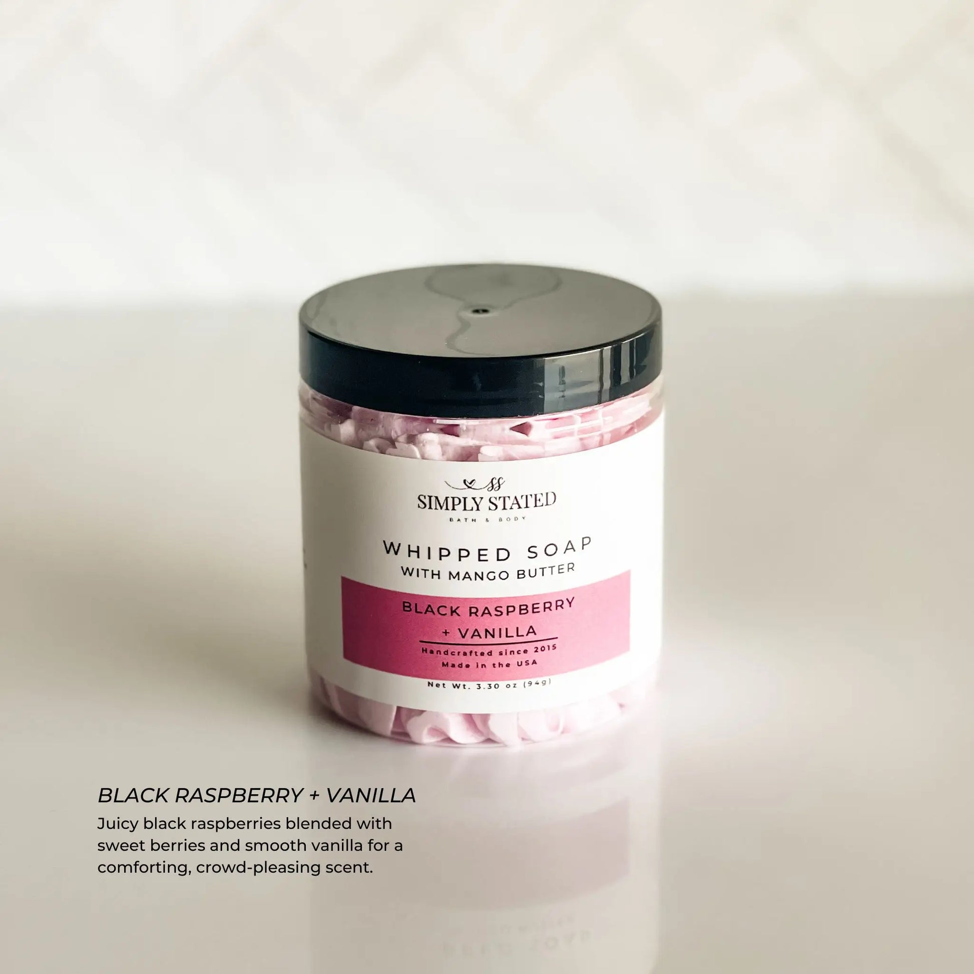 Jar of whipped soap with black raspberry and vanilla scent on a white background