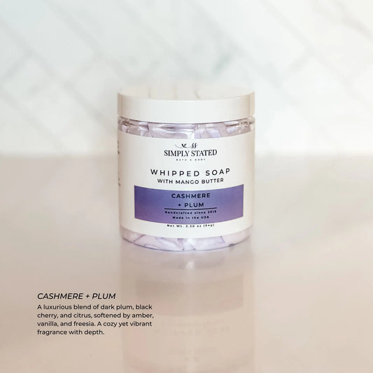 Jar of whipped soap with cashmere and plum fragrance on a white background