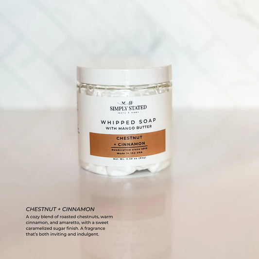 Jar of whipped soap with chestnut and cinnamon scent on a light background