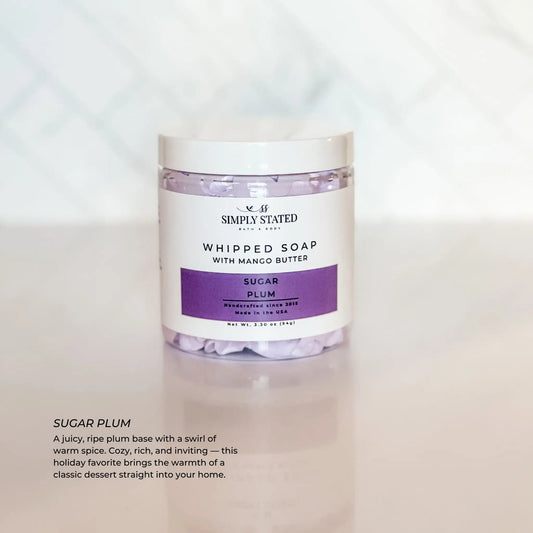 Whipped soap container labeled 'Simply Stated' with 'Sugar Plum' description on a white background