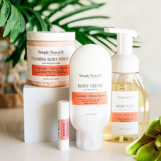 Simply Stated Self Care Starter Kit in Currant and Citrus Spritz — foaming body polish, body creme, foaming hand soap, and Berrytini lip balm, 2026 anniversary scent