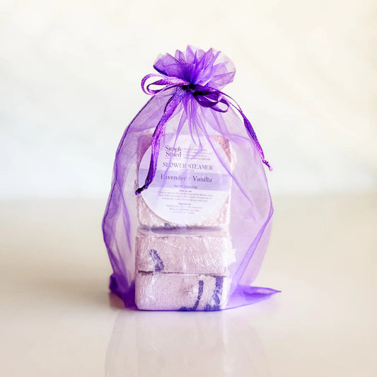 Simply Stated Lavender Vanilla Shower Steamer 3-Pack in purple organza bag — gift-ready menthol steamers handcrafted in Colorado