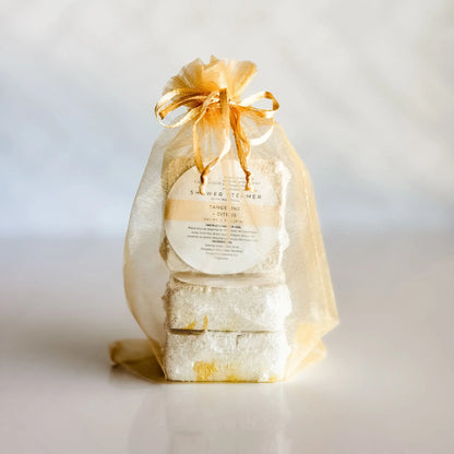 Simply Stated Tangerine Citrus Shower Steamer 3-Pack in gold organza bag — gift-ready menthol steamers handcrafted in Colorado
