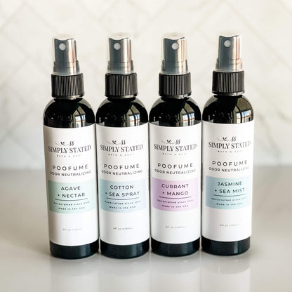 Group of four Simply Stated Poofume 4oz bottles with agave + nectar, cotton + sea spray, currant + mango, and jasmine + sea mist scents.