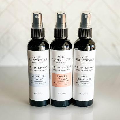 Simply Stated Bath & Body Signature Room Spray collection featuring Lavender + Citrus, Orange + Guava, and Rain + Spearmint, designed for odor-neutralizing freshness.