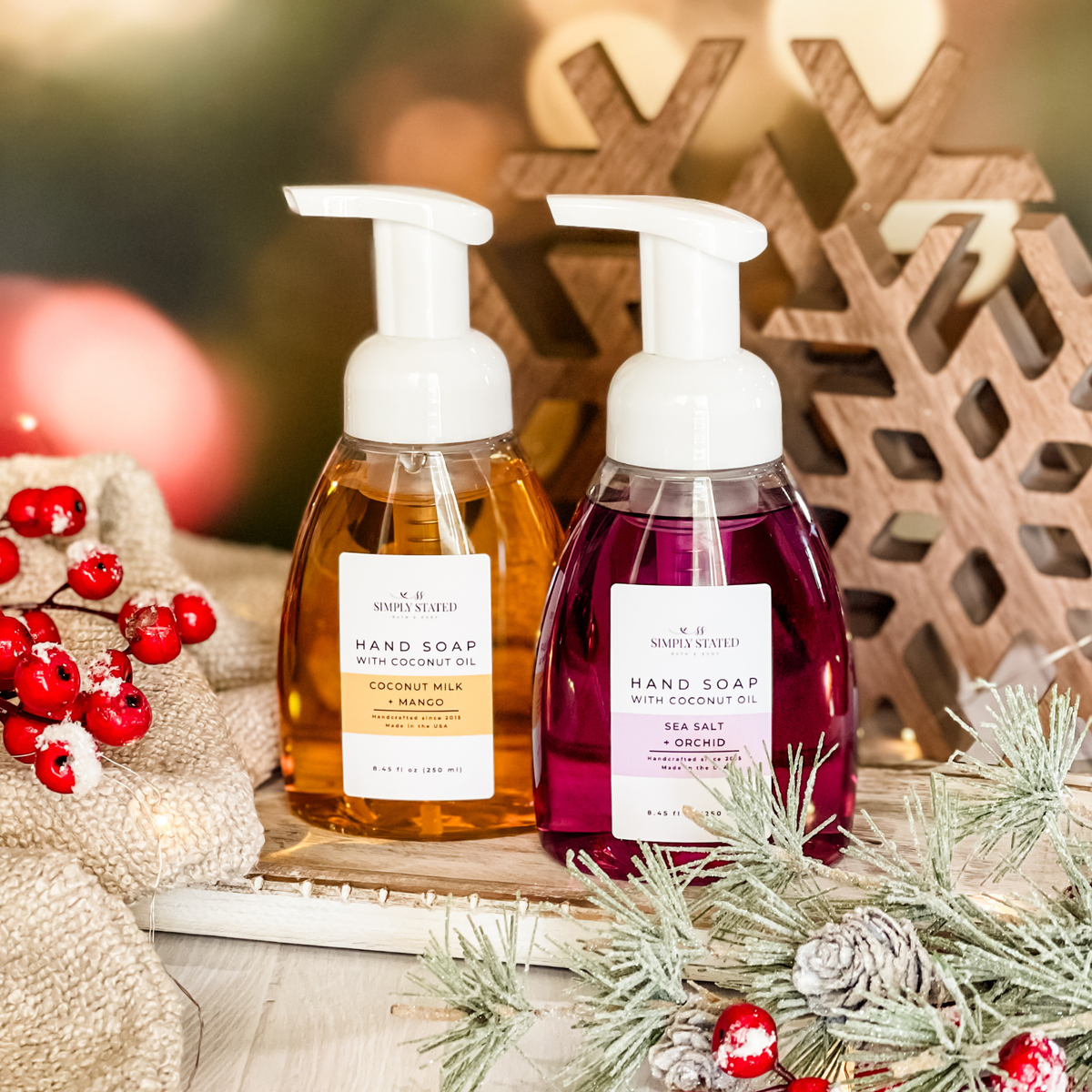 Coconut Milk + Mango and Sea Salt + Orchid hand soaps with coconut oil in a festive winter setting.