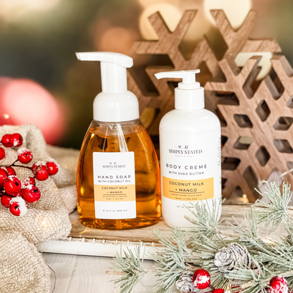 Simply Stated coconut milk mango hand soap and shea butter body creme with holiday berries and wooden snowflakes