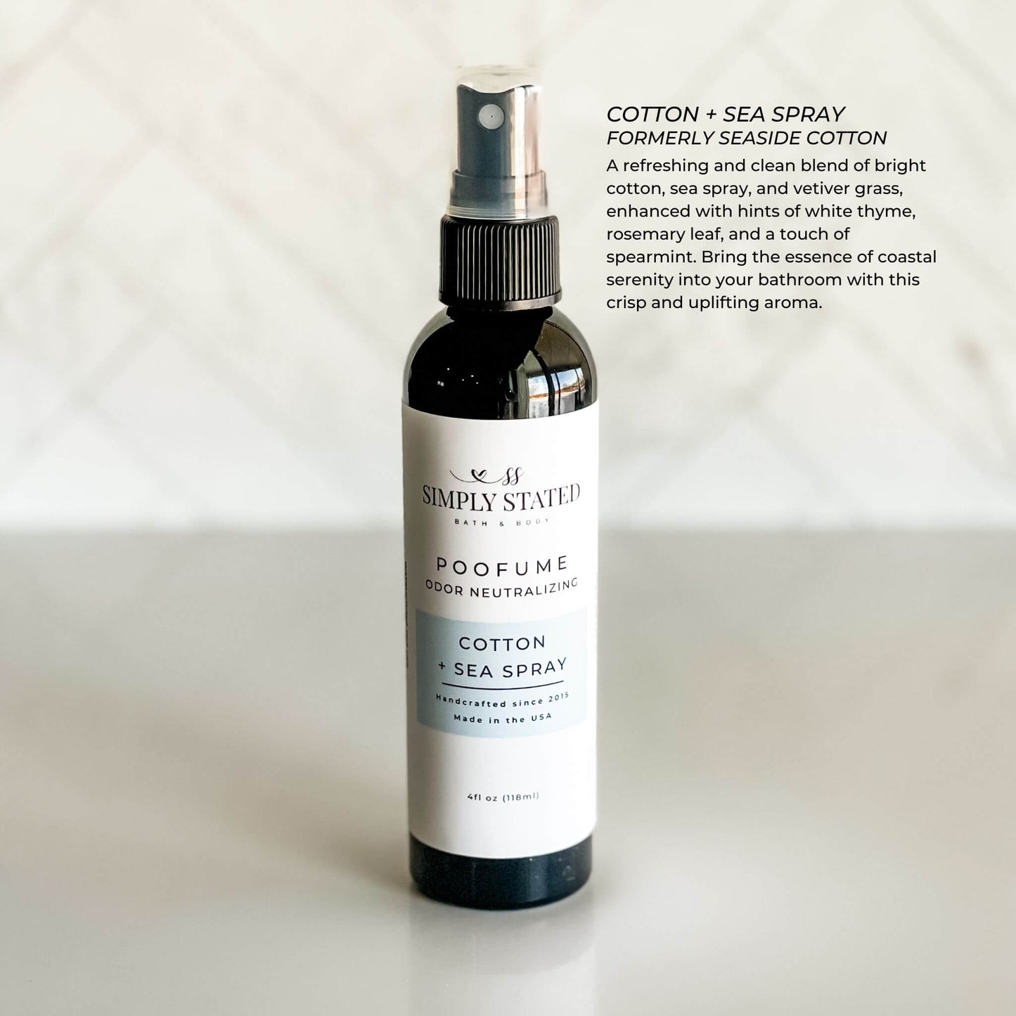 Bottle of Simply Statues Cotton Sea Spray on a white background