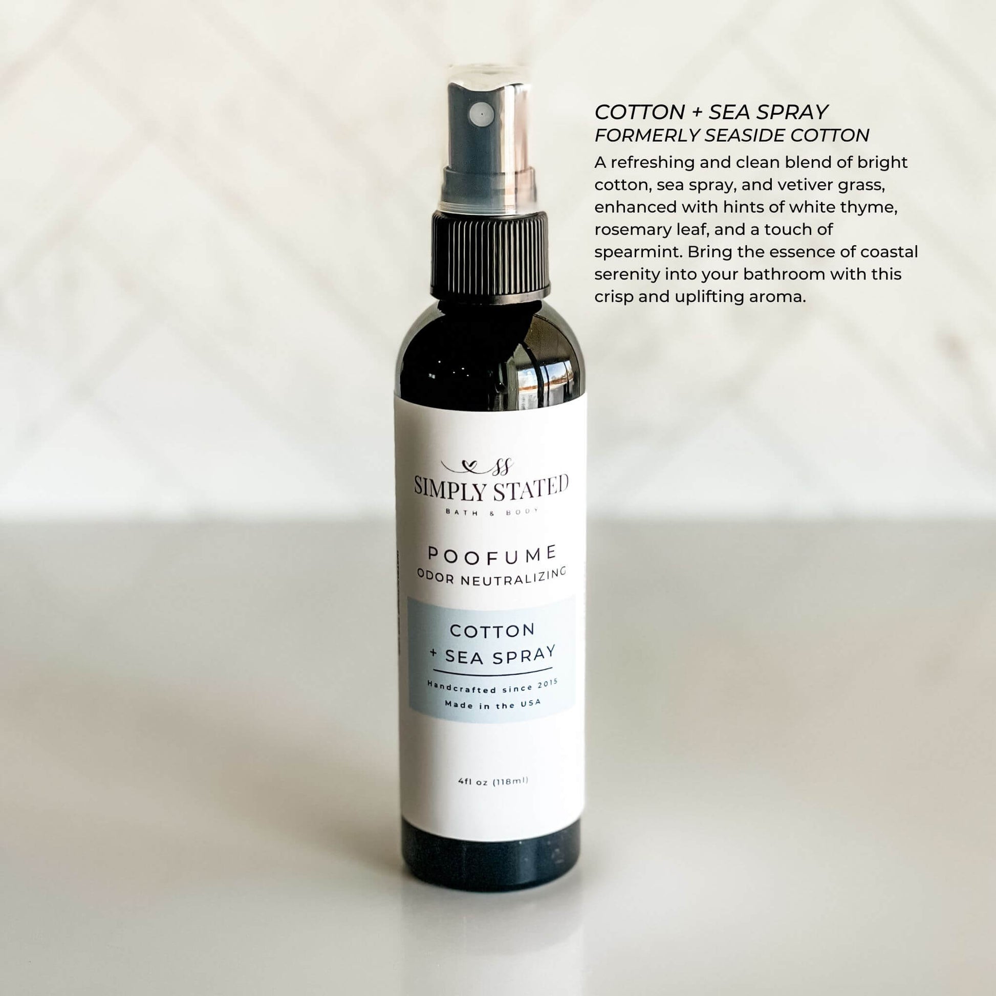 Bottle of Simply Statues Cotton Sea Spray on a white background