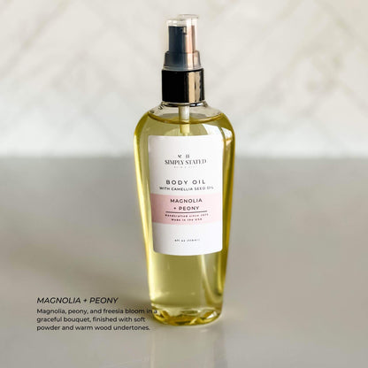 Simply Stated Body Oil in Magnolia + Peony scent with camellia seed oil, offering deep hydration and a graceful floral fragrance.